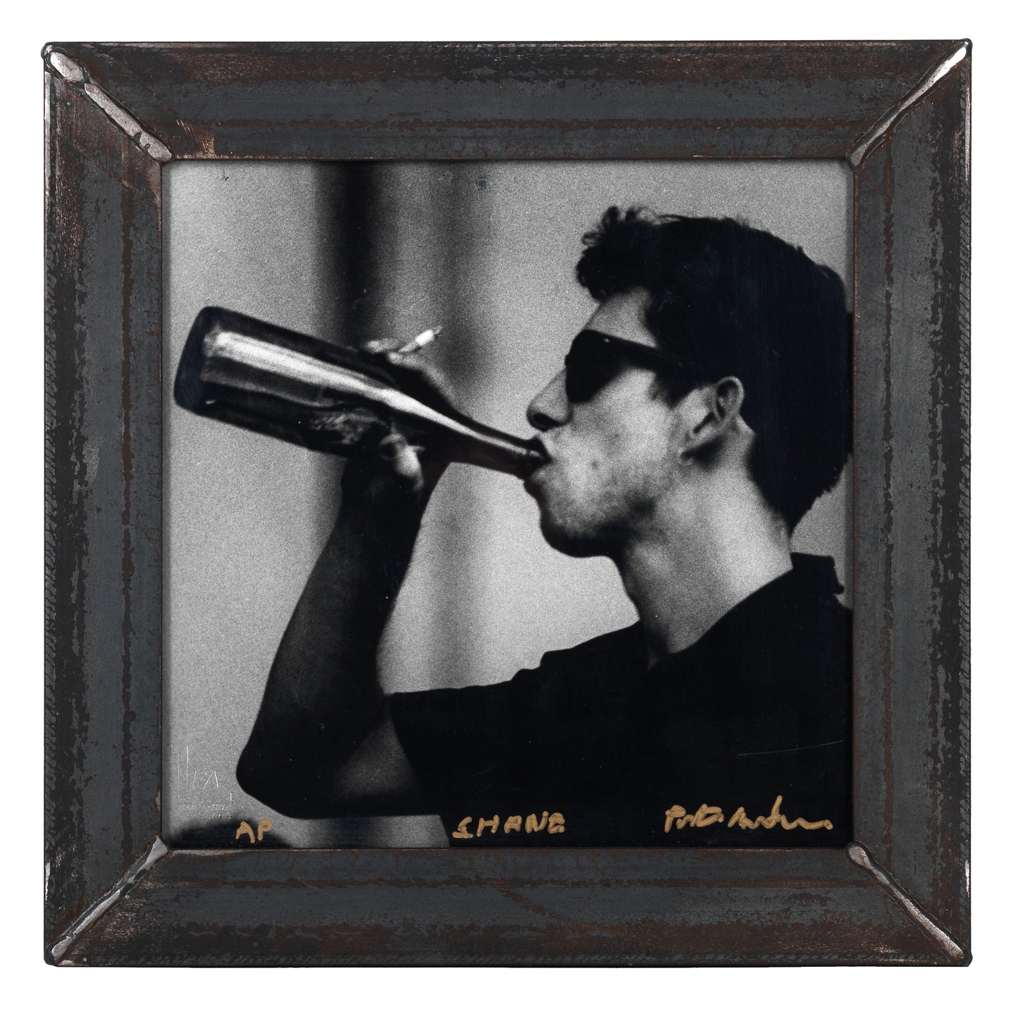 Square black and white silver gelatin darkroom performance print of Shane MacGowan at Cambridge Folk Festival 1985 in a custom welded steel frame by Peter Anderson.