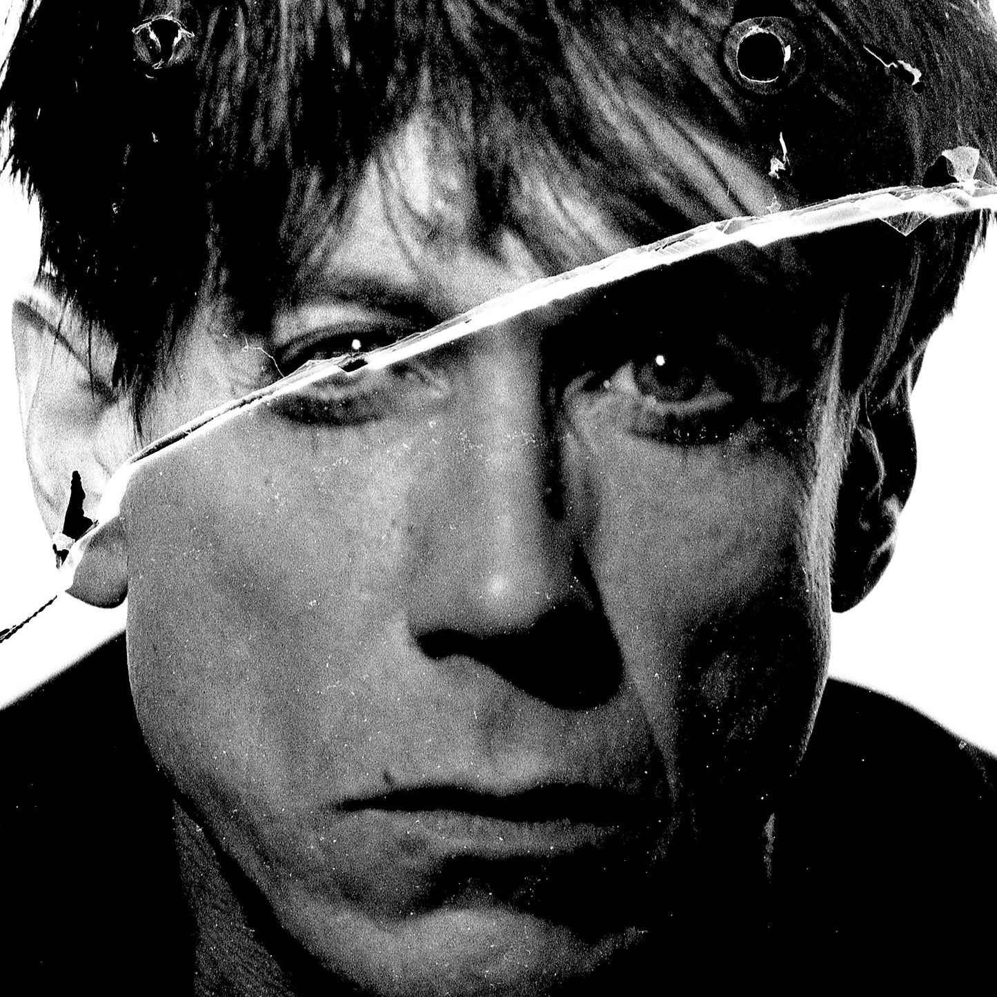 Close-up portrait of Iggy Pop in Mayfair, London, 1986. Rare silver gelatin print from a broken negative with intentional darkroom splashes. Hand-printed and signed by Peter Anderson.