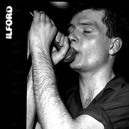 IAN CURTIS - JOY DIVISION on the stage  Moonlight Club, 1980 by Peter Anderson 