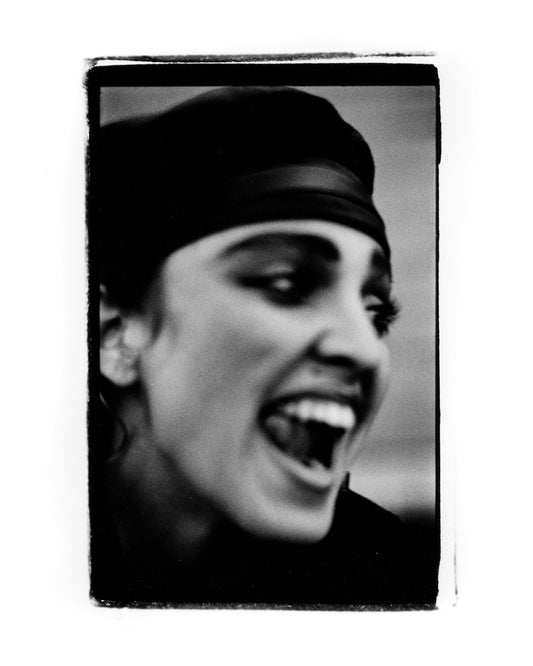 silver gelatin darkroom print of Madonna dancing on a Soho rooftop in London 1983, captured by Peter Anderson.