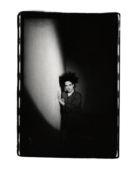 Robert Smith - The Cure. Hiding in the Shadow, Shoreditch | 1986