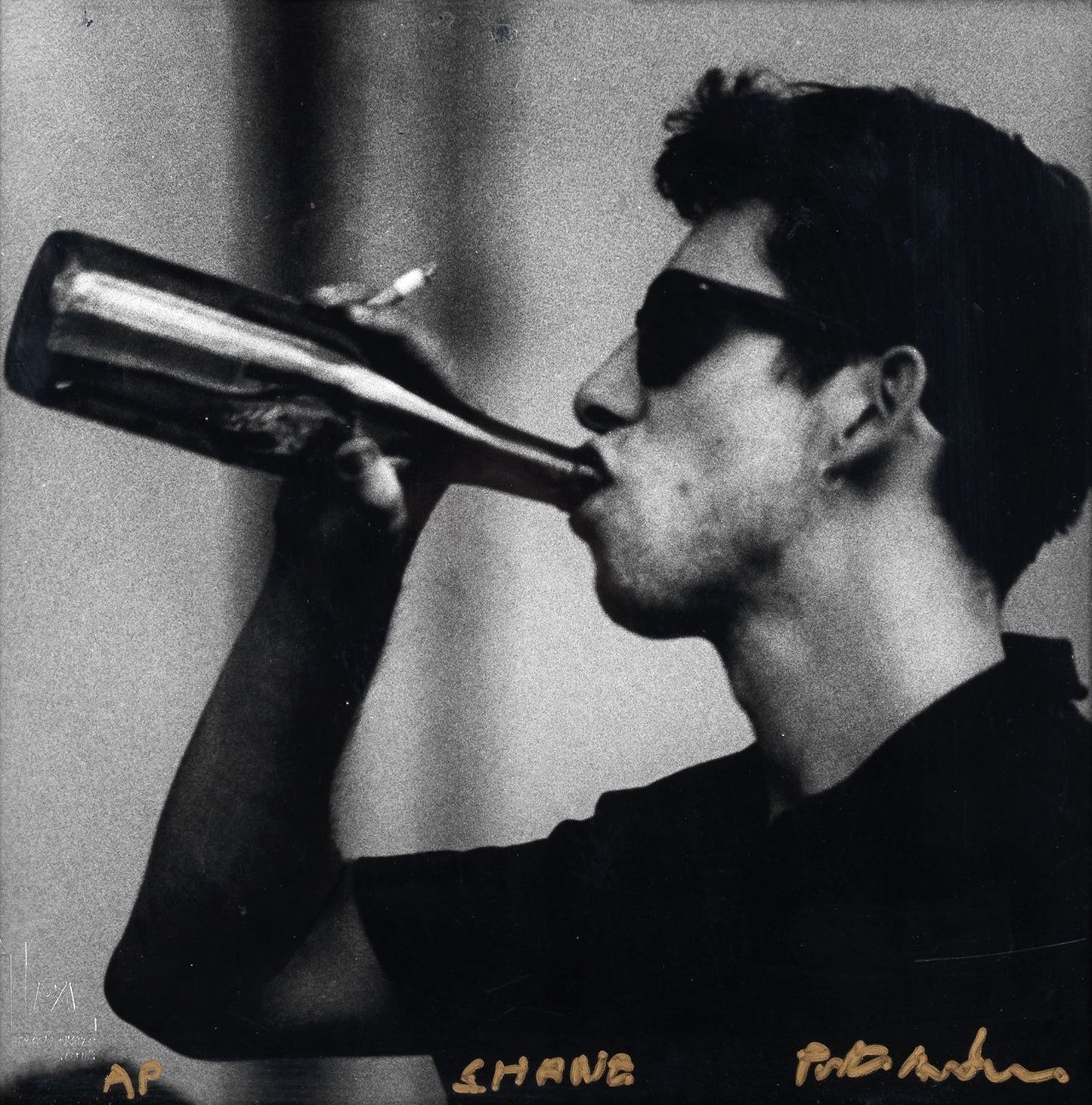 Square black and white silver gelatin darkroom performance print of Shane MacGowan at Cambridge Folk Festival 1985 in a custom welded steel frame by Peter Anderson.