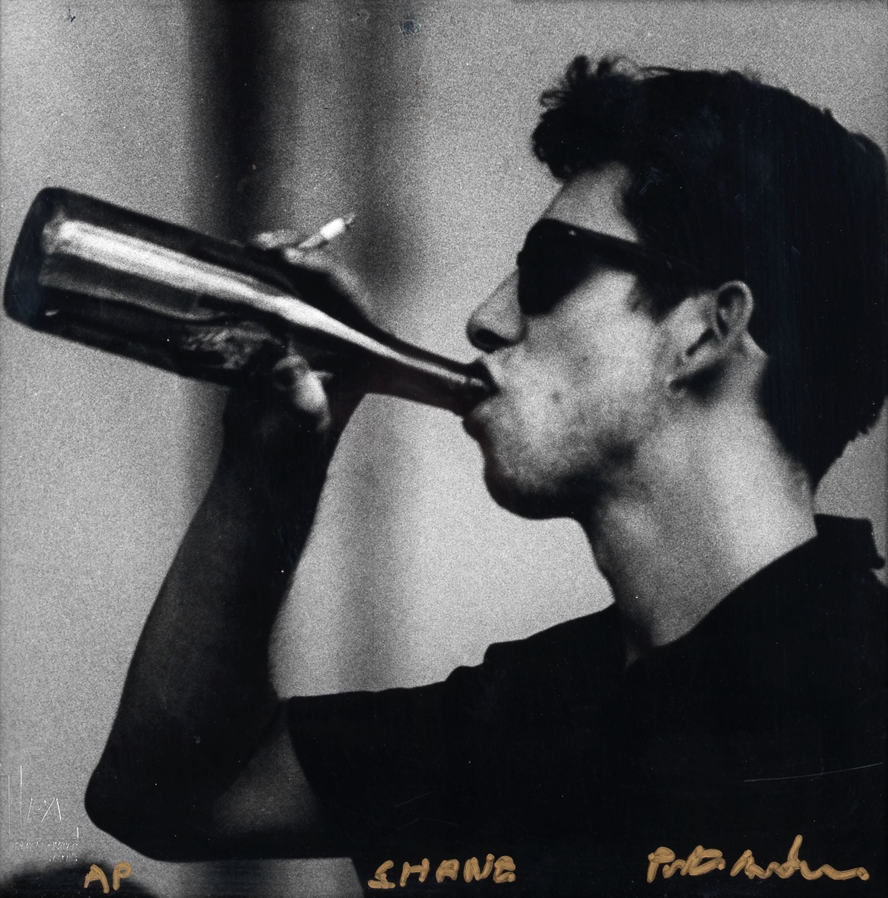 Square black and white silver gelatin darkroom performance print of Shane MacGowan at Cambridge Folk Festival 1985 in a custom welded steel frame by Peter Anderson.